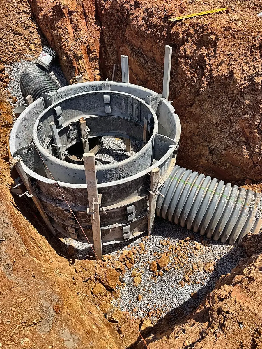 Storm chamber under construction with corrugated drainage pipe